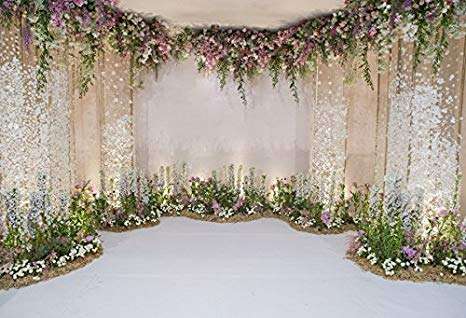 Flowers and drape wedding ceremony backdrop