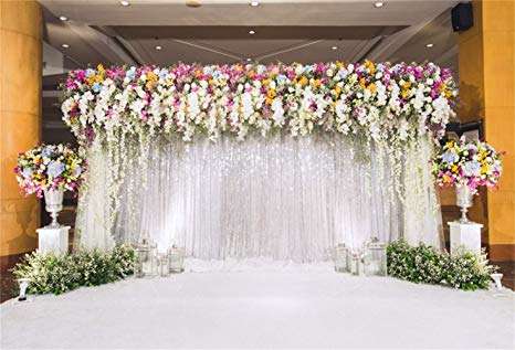 colorful flowers and drape backdrop wedding ceremony