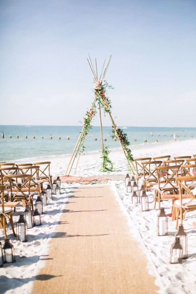 Beach wedding ceremony teepee
